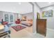 Relaxing bedroom with a comfortable chaise lounge and patio access at 838 Monterey Ne Blvd, St Petersburg, FL 33704