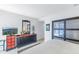 Bedroom with a dresser, TV, and sliding glass doors leading to the outside at 838 Monterey Ne Blvd, St Petersburg, FL 33704