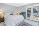 Main bedroom with king-size bed, water views, and private balcony access at 838 Monterey Ne Blvd, St Petersburg, FL 33704