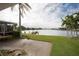 Spacious backyard with a patio and picturesque water views at 905 Oakwood Dr, Largo, FL 33770