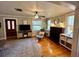 Living room with hardwood floors, fireplace and access to the front door at 1435 29Th N Ave, St Petersburg, FL 33704