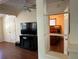 Living room with TV, fireplace, and view into bedroom at 1435 29Th N Ave, St Petersburg, FL 33704