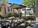 Outdoor patio area with table, chairs, and pergola at 1435 29Th N Ave, St Petersburg, FL 33704