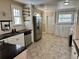 Kitchen with white cabinets, granite countertops, and stainless steel appliances at 1435 29Th N Ave, St Petersburg, FL 33704