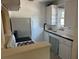 Small kitchen with white cabinets, gas range, and refrigerator at 1435 29Th N Ave, St Petersburg, FL 33704