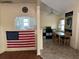 Bright dining area with wood table and chairs, adjacent to kitchen at 1435 29Th N Ave, St Petersburg, FL 33704