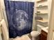 Clean bathroom with a shower/tub combo and shelves at 1435 29Th N Ave, St Petersburg, FL 33704