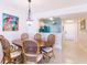Charming dining room with a wooden table and chairs at 16500 Gulf Blvd # 352, North Redington Beach, FL 33708