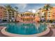 Inviting resort-style pool with surrounding buildings and palm trees at 16500 Gulf Blvd # 352, North Redington Beach, FL 33708