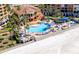Aerial view of resort community with beach access, pool, and lush landscaping at 16500 Gulf Blvd # 352, North Redington Beach, FL 33708