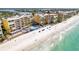 Aerial perspective of beachfront resort with pool and sandy beach at 16500 Gulf Blvd # 352, North Redington Beach, FL 33708