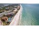 Wide aerial view of beach front property, showing ocean, beach, and resort buildings at 16500 Gulf Blvd # 352, North Redington Beach, FL 33708