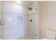 Large walk-in shower with marble tile and pebble floor at 16500 Gulf Blvd # 352, North Redington Beach, FL 33708