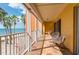 Relaxing balcony with ocean views and palm trees at 16500 Gulf Blvd # 352, North Redington Beach, FL 33708