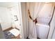 Stackable washer and dryer tucked behind a curtain at 209 Palm Ln, Brooksville, FL 34601