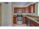 Modern kitchen featuring stainless steel appliances and granite countertops at 2136 Duncan Dr, Belleair Bluffs, FL 33770