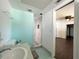 Updated bathroom with a walk-in shower and light teal walls at 2353 Kilgore Dr, Largo, FL 33770