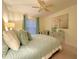 Bedroom with a ceiling fan and coastal inspired decor at 2353 Kilgore Dr, Largo, FL 33770