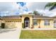 Charming single story home with attached garage and well-manicured lawn at 24617 Laurel Ridge Dr, Lutz, FL 33559