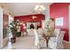 Open dining area with glass table and chairs, looking into the living room at 24617 Laurel Ridge Dr, Lutz, FL 33559