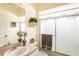 Bright bathroom with a shower, vanity, and linen storage at 24617 Laurel Ridge Dr, Lutz, FL 33559