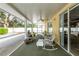 Spacious screened porch with seating and ceiling fan at 24617 Laurel Ridge Dr, Lutz, FL 33559