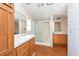 Clean bathroom with wood cabinets and shower/tub combo at 38029 Leondias Dr, Zephyrhills, FL 33542