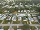 Aerial view of a mobile home community showing numerous homes and landscaping at 38029 Leondias Dr, Zephyrhills, FL 33542