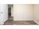 Simple bedroom with beige walls and wood-look flooring at 38029 Leondias Dr, Zephyrhills, FL 33542