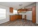 Efficient kitchen featuring wood cabinets and vinyl flooring at 38029 Leondias Dr, Zephyrhills, FL 33542