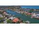 Waterfront homes with private boat docks and manicured lawns, as seen from an aerial view at 4380 44Th S St, St Petersburg, FL 33711