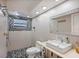 Modern bathroom with sleek fixtures, a walk-in shower, and stylish tile accents at 4380 44Th S St, St Petersburg, FL 33711