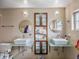 Modern bathroom featuring dual sinks, stylish mirrors, and ample storage in a central cabinet at 4380 44Th S St, St Petersburg, FL 33711
