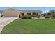 Well-maintained home with lush green lawn, mature landscaping, and inviting curb appeal at 4380 44Th S St, St Petersburg, FL 33711