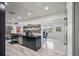 Modern kitchen with open shelving, stainless appliances and view to dining area at 4380 44Th S St, St Petersburg, FL 33711