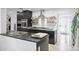Modern kitchen featuring stainless steel appliances, sleek cabinetry and subway tile backsplash at 4380 44Th S St, St Petersburg, FL 33711