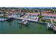 Back of property showcasing pool and boat lift near the water at 4380 44Th S St, St Petersburg, FL 33711