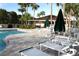 Community pool with patio furniture and umbrellas at 6425 Shoreline Dr # 10503, St Petersburg, FL 33708