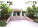 Community building with entrance and landscaping at 6425 Shoreline Dr # 10503, St Petersburg, FL 33708