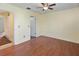 Bedroom with wood-look flooring and access to bathroom at 131 114Th Ne Ter # 131, St Petersburg, FL 33716