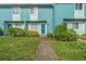 Teal condo building with walkway at 131 114Th Ne Ter # 131, St Petersburg, FL 33716