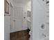 Clean bathroom with shower/tub, dark tile floors, and built-in shelving at 131 114Th Ne Ter # 131, St Petersburg, FL 33716
