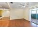 Living room with wood floors and a mirrored wall at 131 114Th Ne Ter # 131, St Petersburg, FL 33716