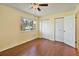 Bright bedroom with wood-look flooring and double closets at 131 114Th Ne Ter # 131, St Petersburg, FL 33716