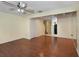 Bright living room with wood-look floors and a view to the kitchen at 131 114Th Ne Ter # 131, St Petersburg, FL 33716