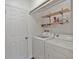 Laundry room with washer, dryer, and extra storage at 131 114Th Ne Ter # 131, St Petersburg, FL 33716