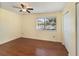 Bedroom with wood-look floors and a large window at 131 114Th Ne Ter # 131, St Petersburg, FL 33716