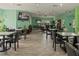 Community clubhouse with seating area and large screen TV at 131 114Th Ne Ter # 131, St Petersburg, FL 33716