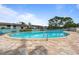 Community pool with surrounding patio and lounge chairs at 131 114Th Ne Ter # 131, St Petersburg, FL 33716