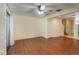 Living room with wood-look floors and access to a patio at 131 114Th Ne Ter # 131, St Petersburg, FL 33716